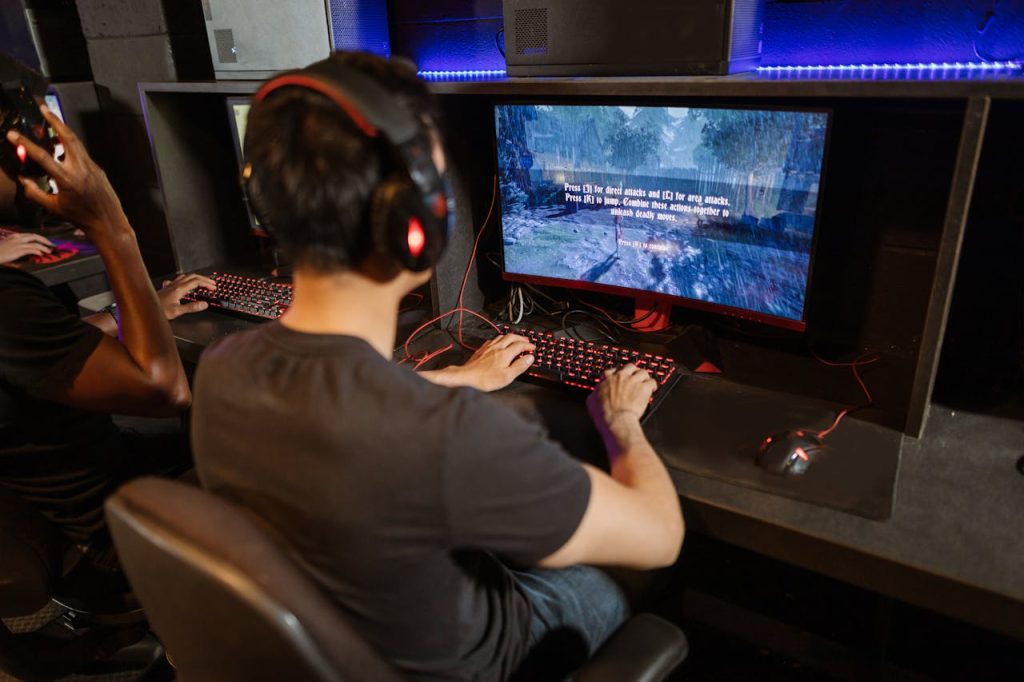 Two gamers immersed in a video game with high-tech equipment and vibrant gaming setup.